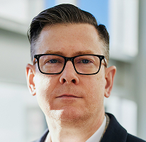 CEO and executive portrait of Alexander Hughes at a crypto trading company